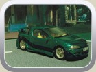 Tigra A Extremtuning Bild 2
Dieser Tigra wurde rundum veredelt. Front- , Heckschürze, Seitenschweller, Heckflügel und Auspuffrohre sind Eigenanfertigungen. Am Seitenschweller habe ich noch je ein Lüftungsloch angebracht. Dieser Umbau soll ein bisschen an Fast-and-the-furios-Style erinnern. Leider sind die Farben hier nicht gut zu erkennen, lackiert wurde in blaugrün Diamanteffekt und Blaulilametallic. Auch der Innenraum wurde der Karosserie farblich angepasst und auf der Heckablage ein silberner Opel-Blitz aufgemalt.